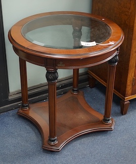 A pair of Empire style circular mahogany glass top occasional tables, larger diameter 60cm, height 61cm